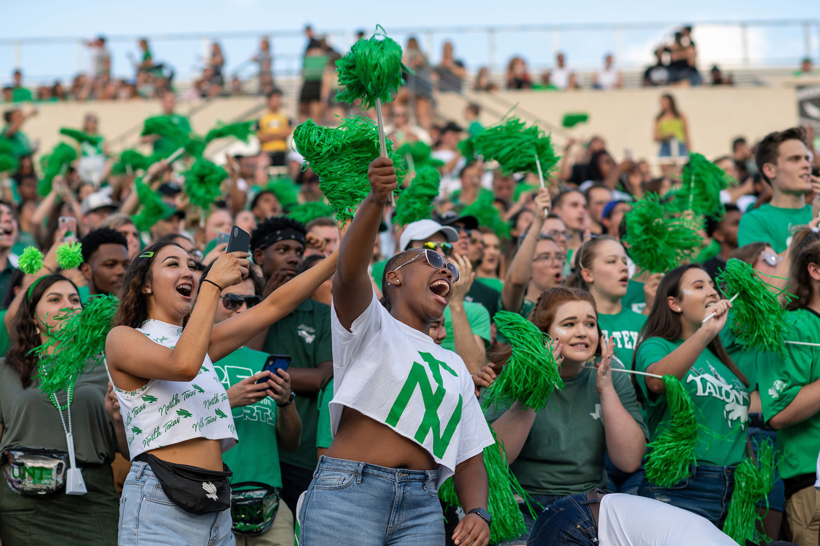 Students cheering on the UNT football team